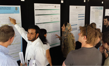 Students showcasing their posters